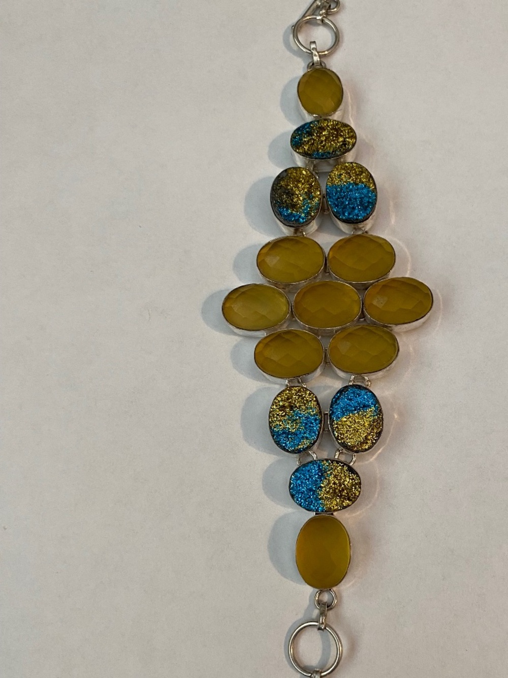 Sterling silver bracelet w/ yellow gemstones paired w/ blue & gold druzy stones